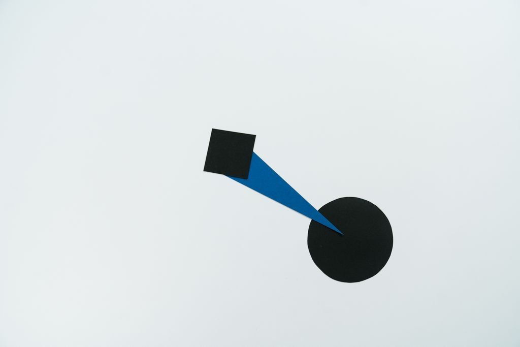 An abstract composition featuring geometric shapes on a neutral background, highlighting modern art style.